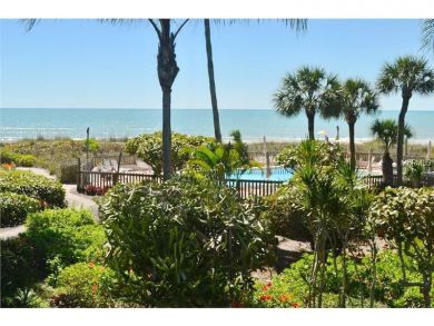 Just Steps to the Sandy Beach from this Two Bedroom Condo